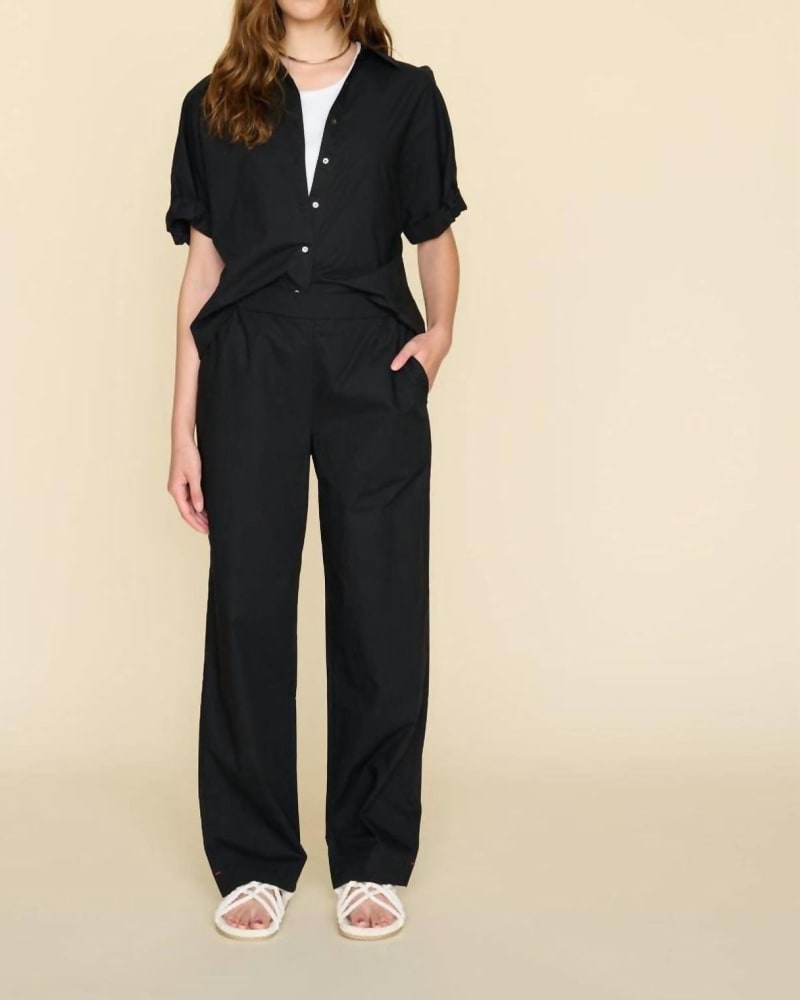Front of a model wearing a size L Demsey Crisp Pant in Black in Black by XIRENA. | dia_product_style_image_id:338152